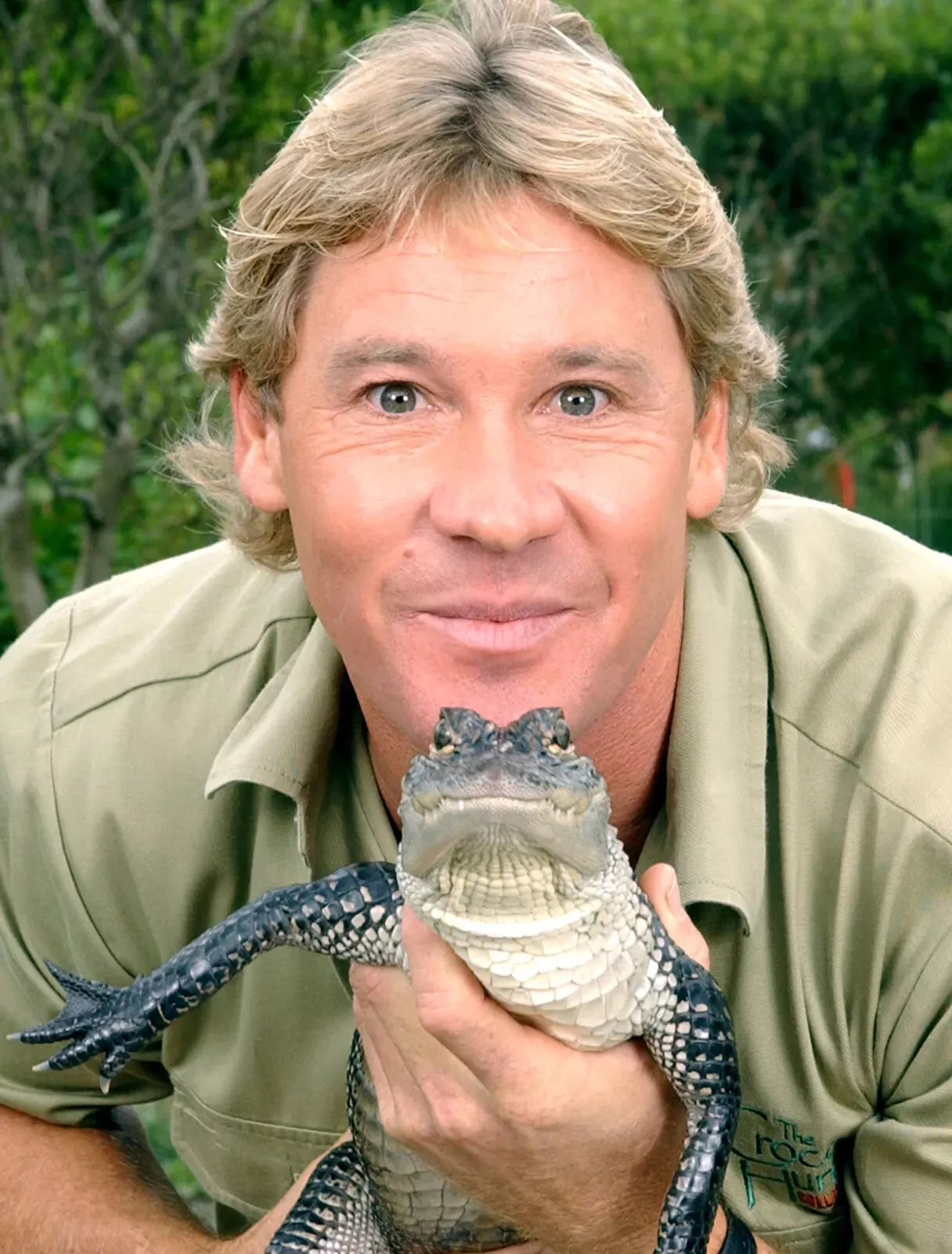 Steve Irwin holding a baby croc